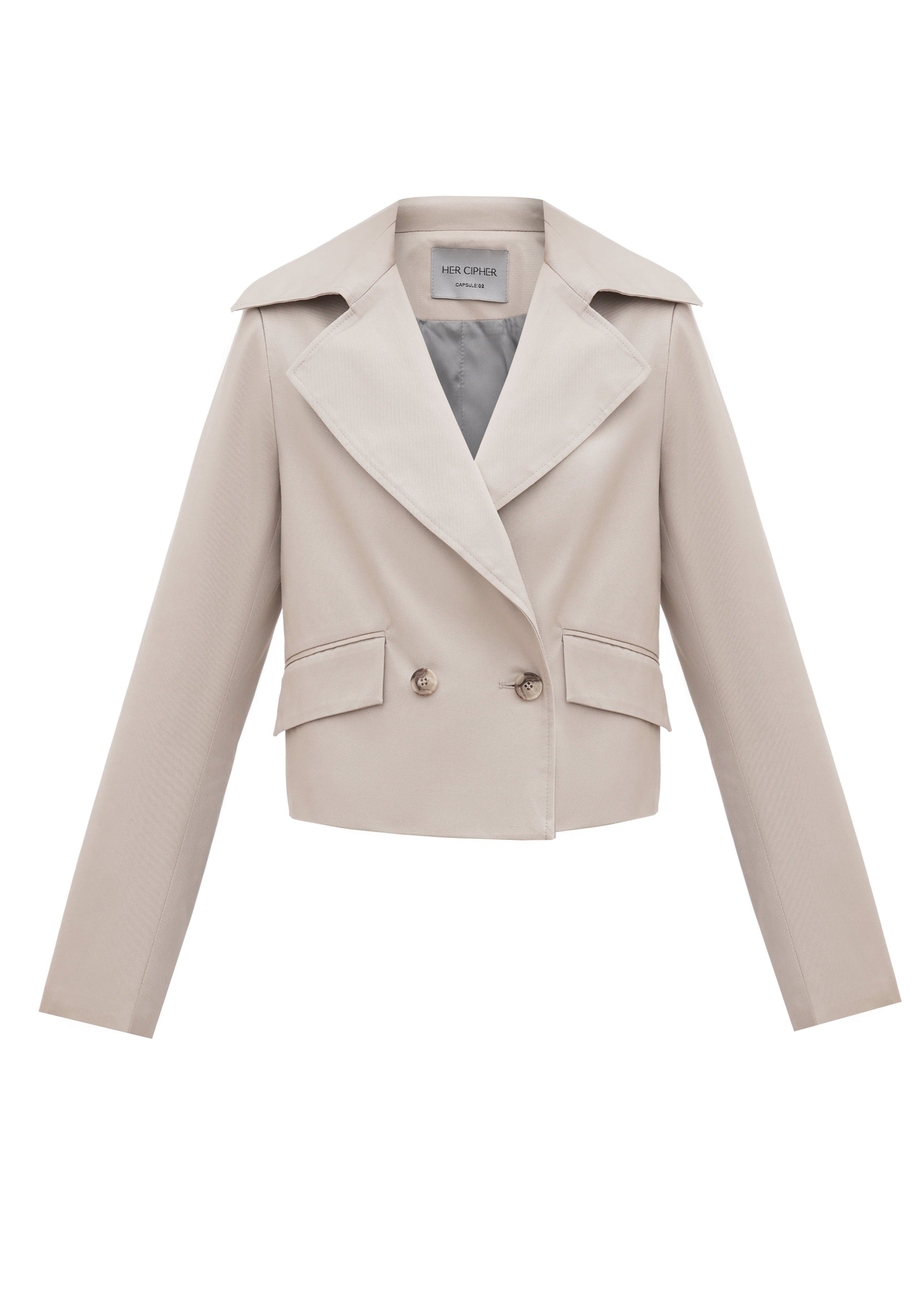 A front of a SeaSycle cropped jacket by HER CIPHER created from resycled polyester and organic cotton in color Sand