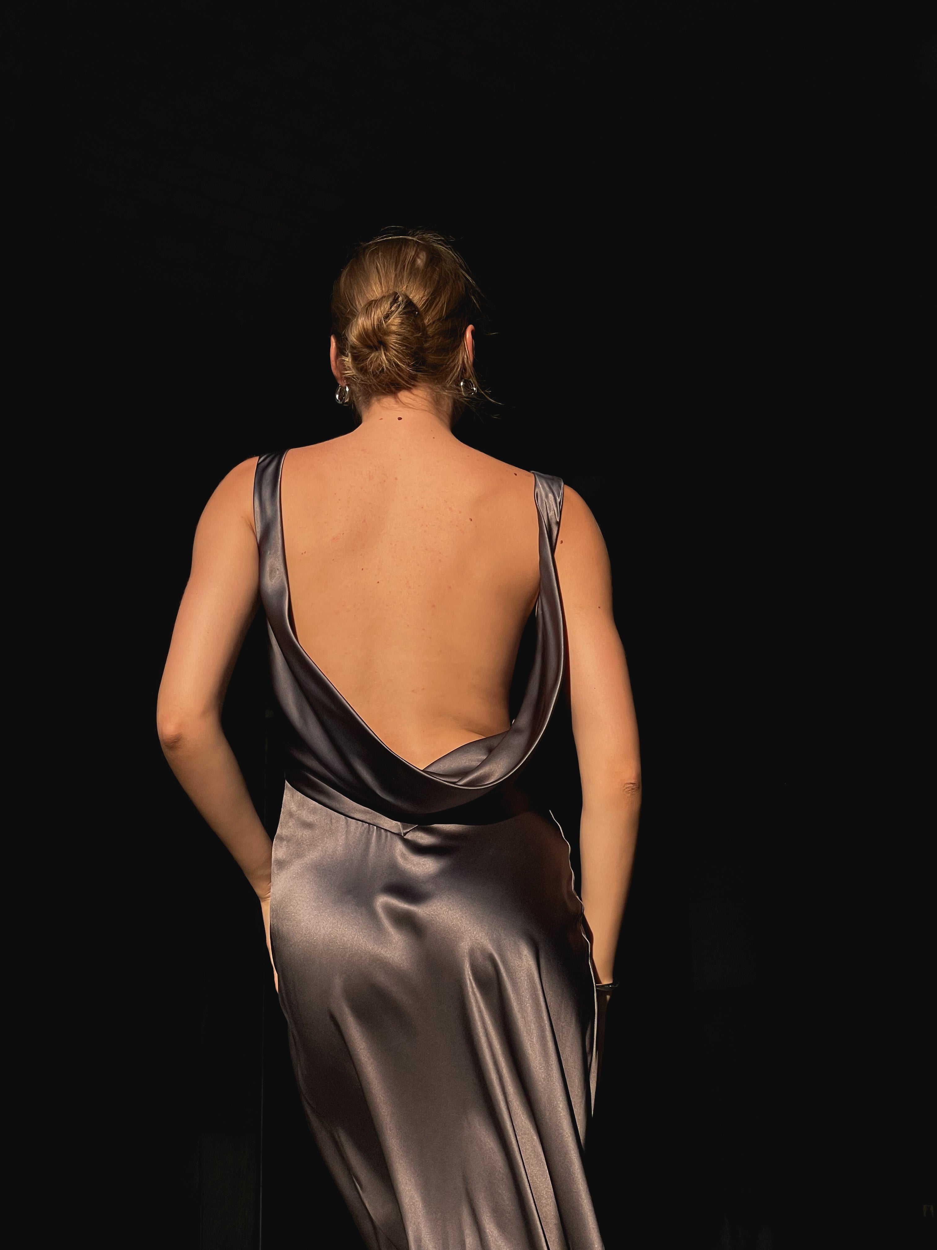 A beautiful open-back grey sustainable 100% silk dress