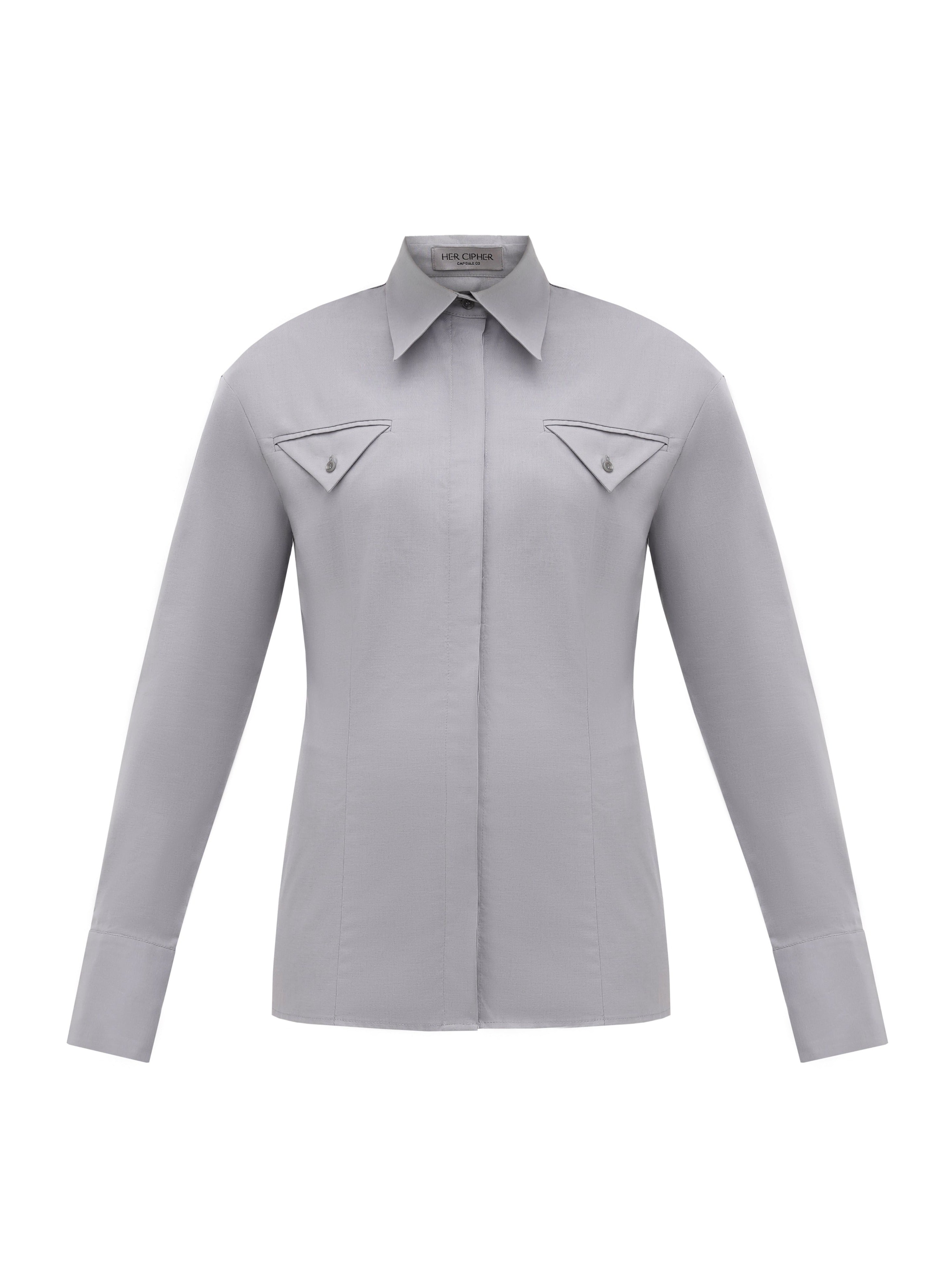 A sustainable organic cotton shirt in grey color with pointed collar and two triangular pocket details at chest