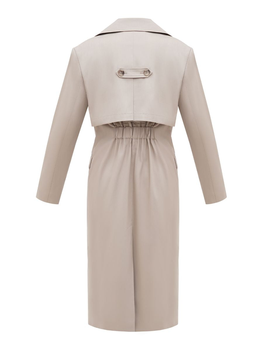 A back of a classic trench coat with a elastic detail for waist definition