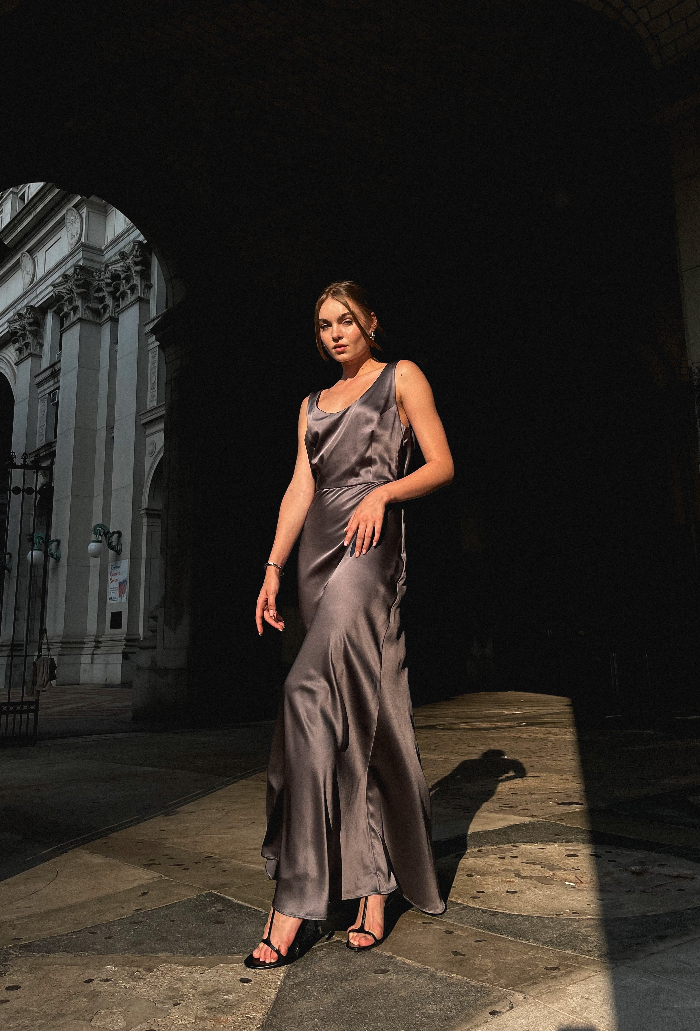 Beautiful model posing in long grey 100% silk Moonlight dressdress 